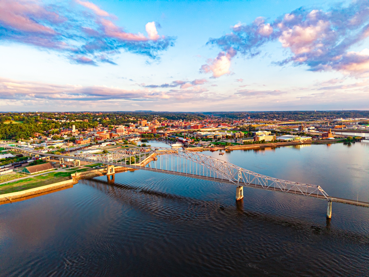 Dubuque, Iowa skyline and Mississippi River bridge at sunset